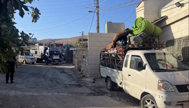 Vehicles loaded with household items stand as residents leave their homes in the predominantly Alawite neighbourhood of al-Somaria, under eviction orders issued by Syrian authorities, in Damascus, Syria, Aug. 29, 2025 – Reuters