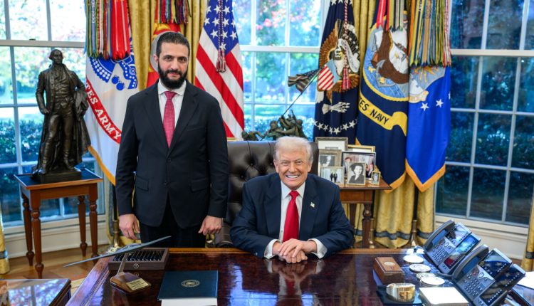 U.S. President Donald Trump sits at the Resolute Desk in the Oval Office alongside Syria's Transitional President Ahmad al-Sharaa on Monday, Nov. 10, 2025. – Trump's Truth Social