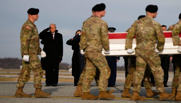 U.S. President Donald Trump salutes as carry teams move the transfer case with the remains of Sgt. Edgar Brian Torres-Tovar on Dec. 17, 2025 at Dover Air Force Base, Del. – AP