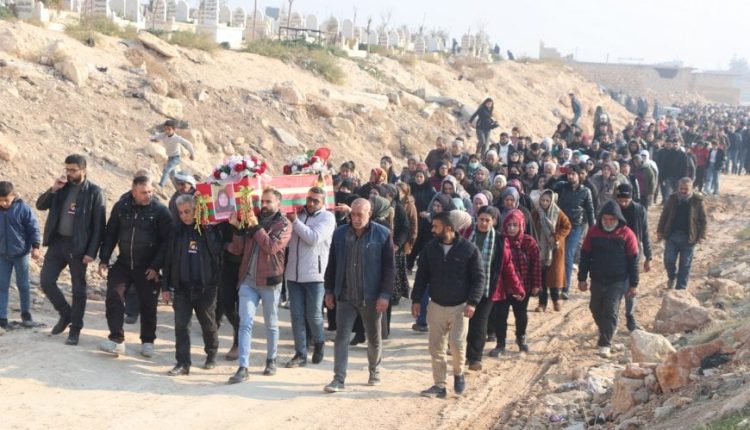 Residents of Aleppo's Sheikh Maqsoud and Ashrafiyeh taking part in the funeral of Fadwa Mohammed al-Kurdi, 57, on Dec. 24, who was killed in shelling by the government forces on Dec. 22, 2025. – ANHA