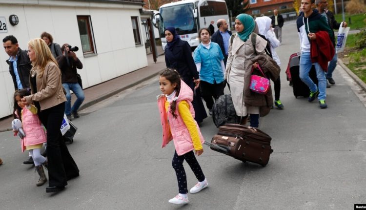 Syrian refugees arrive at the camp for refugees and migrants in Friedland, Germany, April 4, 2016. – Reuters