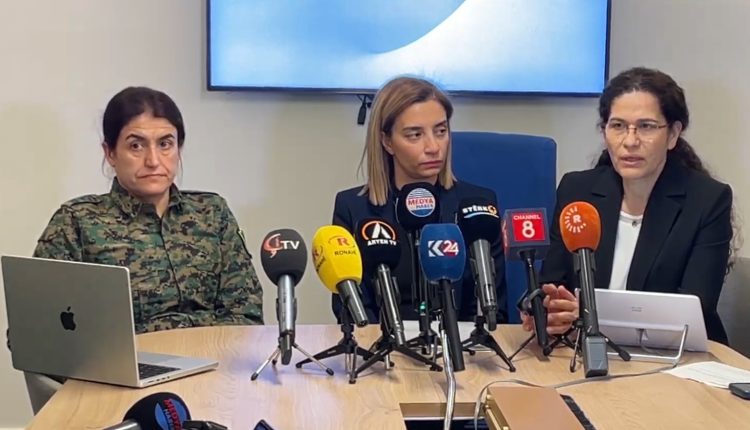 .@ElhamAhmadSDC (right), AANES Foreign Relations Co-Chair, Evin Incir (middle), member of the European Parliament, and @RohilatAfrin (left), Commander of the YPJ in a press conference in Brussels on Feb. 25, 2026. – K24