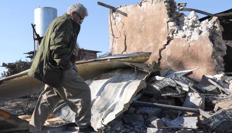 A member of the Democratic Party of Iranian Kurdistan inspects the damage following an attack in the Koya district of Erbil, Iraq, on March 4, 2026. – AFP