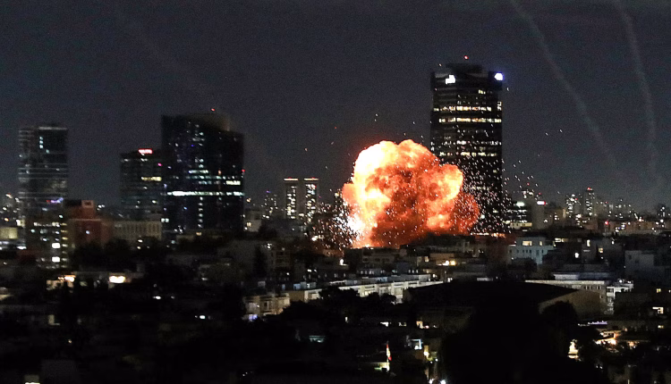 An explosion caused by a projectile impact after Iran launched missiles into Israel following Israel and the U.S. launched strikes on Iran, in Tel Aviv, Israel, on Feb. 28. – Reuters
