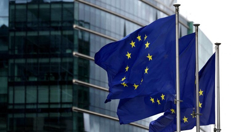 European Union flags outside the European Commission headquarters in Brussels.