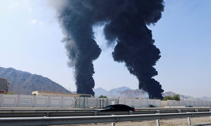 Smoke rises in the Fujairah oil industry zone, UAE, caused by debris after interception of a drone by air defenses, March 14, 2026. – Reuter