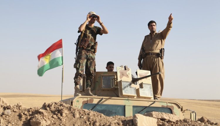 Kurdish Peshmerga fighters on an armored vehicle during a security deployment against ISIS militants on the frontline in Khazer, Aug. 8, 2014. – Reuters