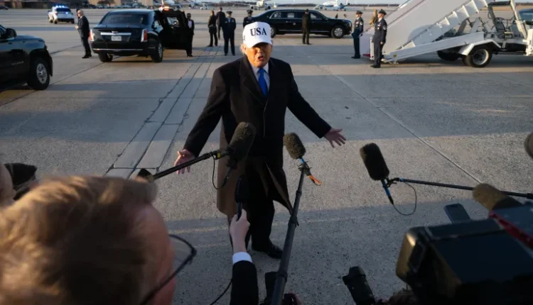 U.S. President Donald Trump speaks to reporters before boarding Air Force One as he departs Joint Base Andrews in Maryland – AFP