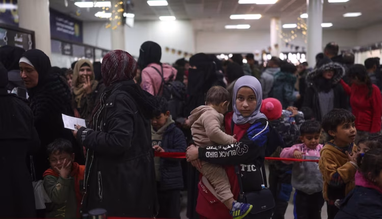 Syrians fleeing Israeli airstrikes in Lebanon check in at the Jdeidet Yabous border crossing in Syria on March 3, 2026. – AP