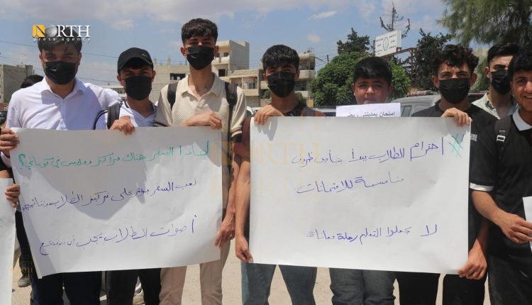 Students in Kobani calling for relocation of exam centers.