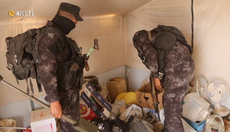 Two members of the Asayish searching a tent during a security sweep in Hawl Camp in northeastern Syria in on April 22, 2025. – North Press