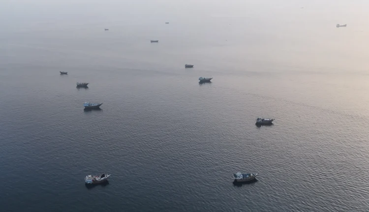 Vessels anchored off Oman's northern Musandam Peninsula near the Strait of Hormuz, June, 27, 2026. - AFP