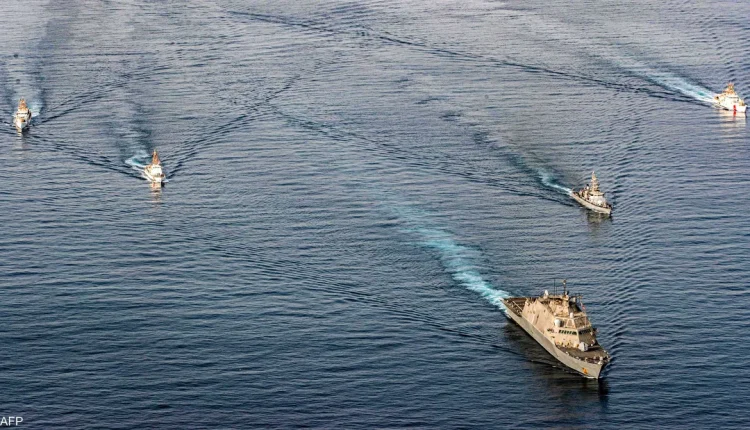 U.S. Navy ship and Coast Guard vessels participating in an exercise during transit of the Strait of Hormuz. - AFP