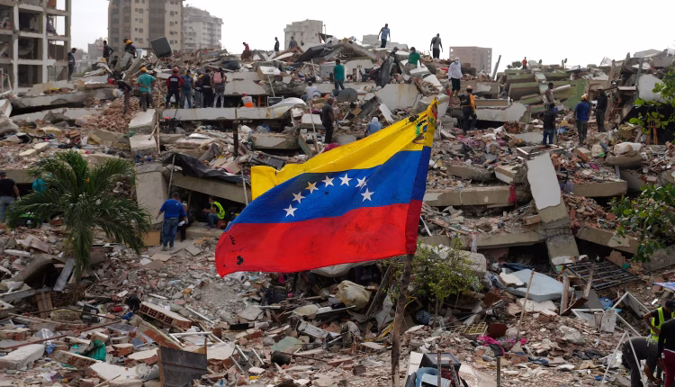 Residents and rescue workers search through the rubble of buildings damaged in the June 24 earthquakes that struck La Guaira, Venezuela. July 2, 2026. - AP