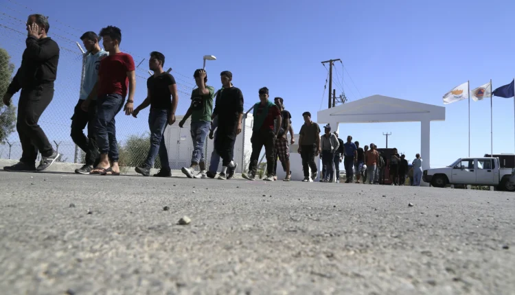 Migrants from Syria walk towards a refugee camp at Kokkinotrimithia outside of the capital Nicosia in the eastern Mediterranean island of Cyprus on Sep. 10, 2017. – AP