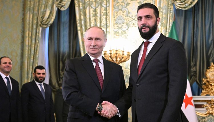 Syrian President Ahmad al-Sharaa and Vladimir Putin shake hands during talks in the Kremlin, Oct. 15. - Reuters