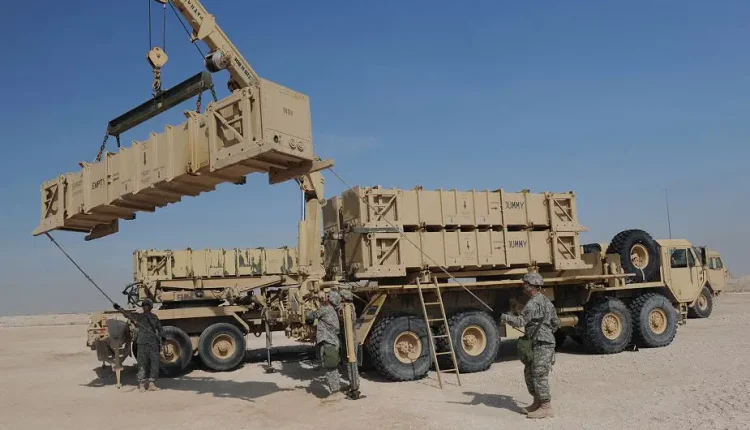 U.S. Army Patriot Launch Station operator/maintainers rom Bravo Battery, 1-43 Air Defense Artillery, hold a tag line to keep a missile canister steady during a guided-missile transporter reload certification activity at a non-disclosed Southwest Asia location, Feb. 12, 2010. – U.S. Air Force
