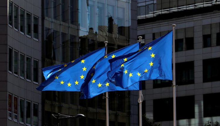 European Union flags flutter outside the European Commission headquarters in Brussels, Belgium Aug. 21, 2020. - Reuters