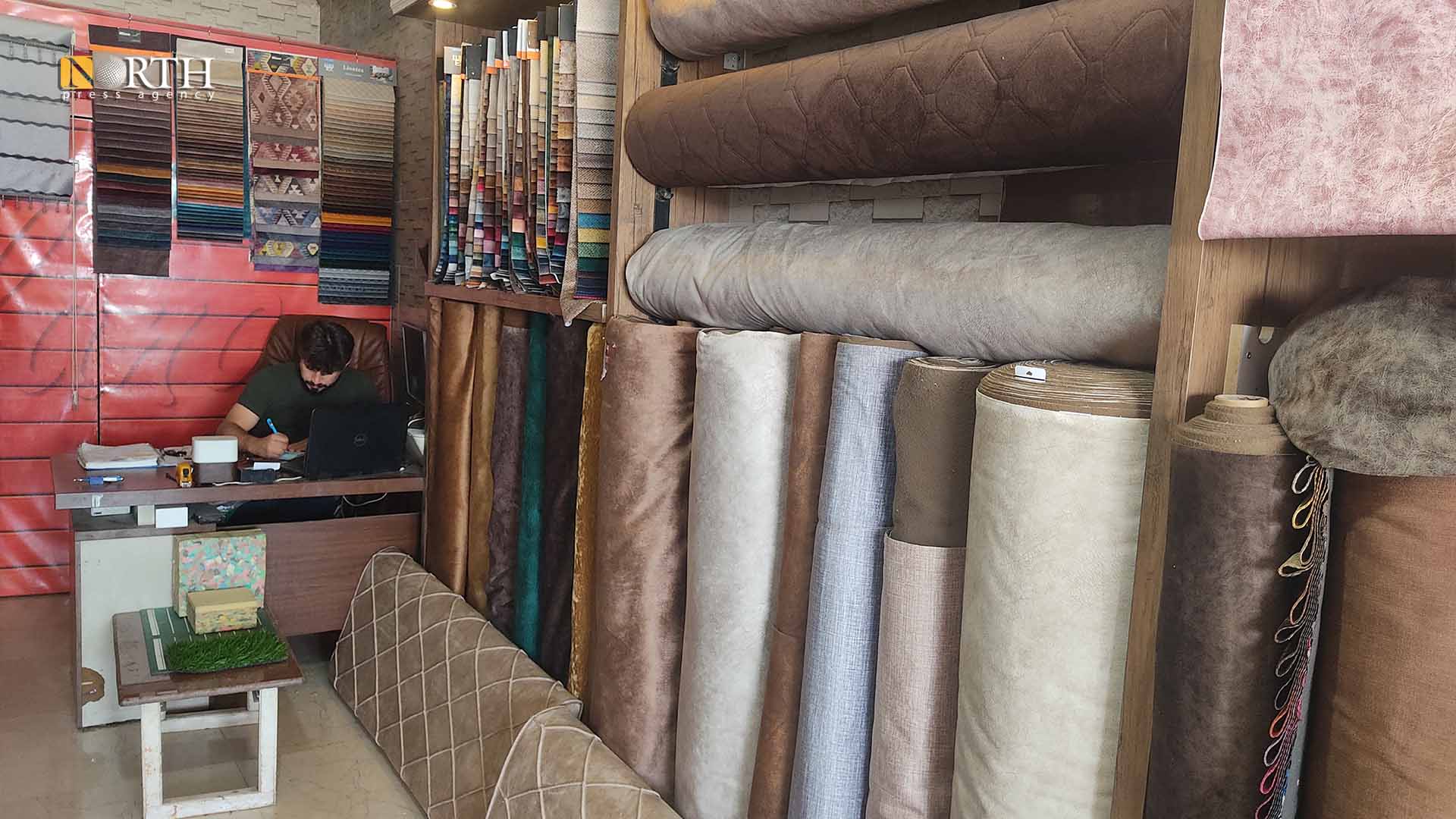 أحد محلات الأقمشة في حلب – نورث برس