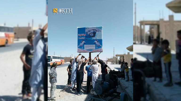 تعليق صورة لقتيل من الدفاع الوطني بريف دير الزور
